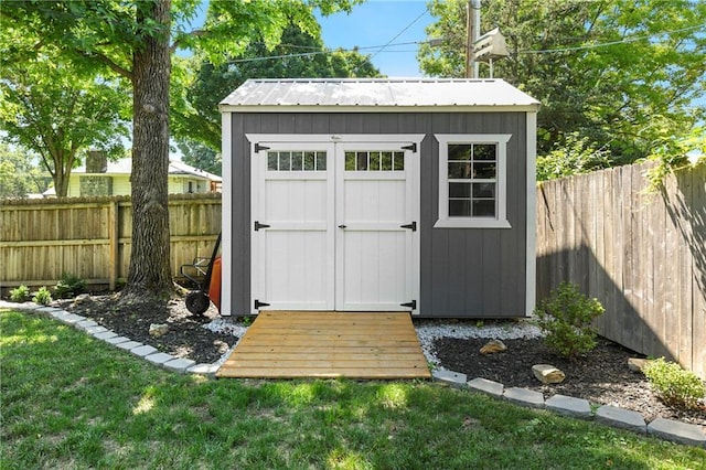 1410 Vilas St, Leavenworth, KS 66048 - view of shed featuring a fenced backyard