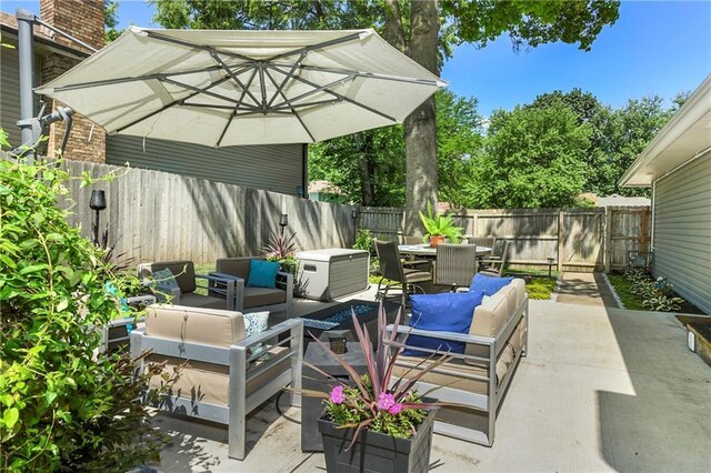 1410 Vilas St, Leavenworth, KS 66048 - fenced backyard with a patio, outdoor dining area, and an outdoor living space