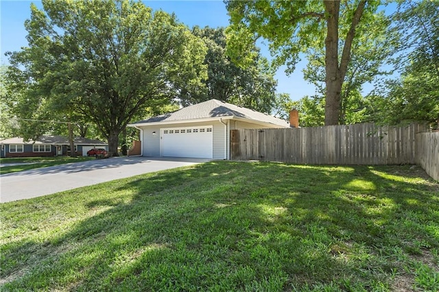 1410 Vilas St, Leavenworth, KS 66048 - view of yard featuring driveway and a garage