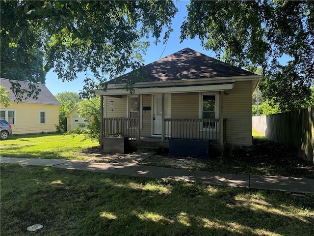 310 E 3rd Ave, Garnett, KS 66032 - bungalow-style house with a porch and a shingled roof