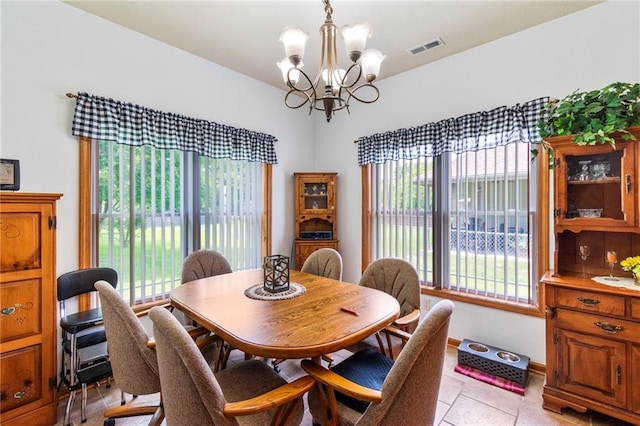 903 Howenstein St, Cameron, MO 64429 - dining room with a chandelier and light tile patterned floors