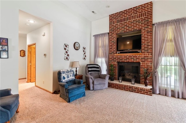 903 Howenstein St, Cameron, MO 64429 - carpeted living room with a fireplace and baseboards