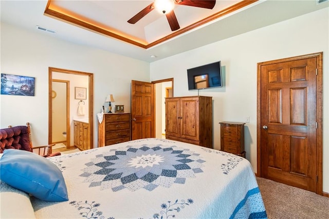 903 Howenstein St, Cameron, MO 64429 - bedroom with carpet flooring, a raised ceiling, a ceiling fan, and connected bathroom