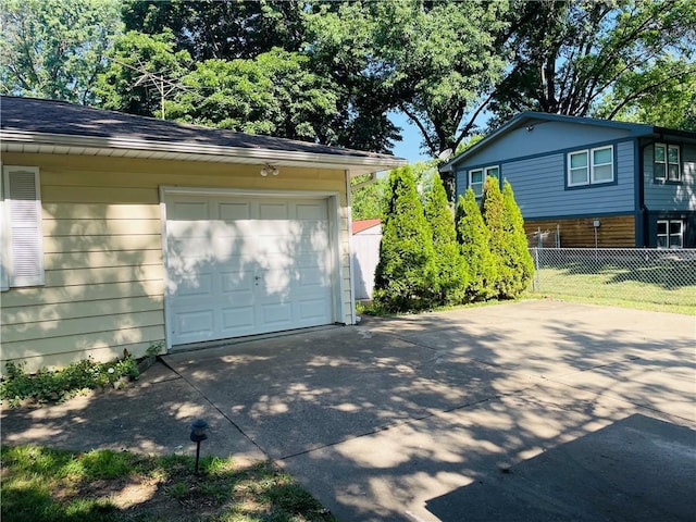506 1st Ter, Lansing, KS 66043 - detached garage featuring driveway
