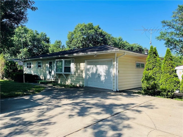 506 1st Ter, Lansing, KS 66043 - view of front facade featuring an attached garage and driveway