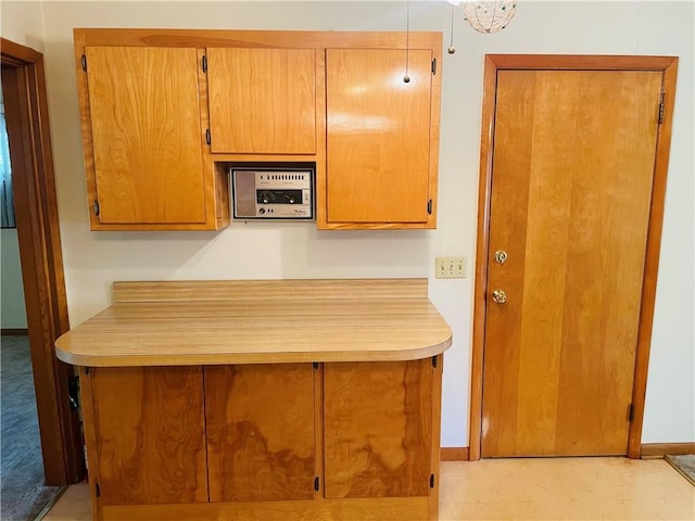 506 1st Ter, Lansing, KS 66043 - kitchen with light countertops and a peninsula