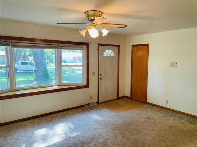 506 1st Ter, Lansing, KS 66043 - carpeted foyer entrance featuring ceiling fan and baseboards