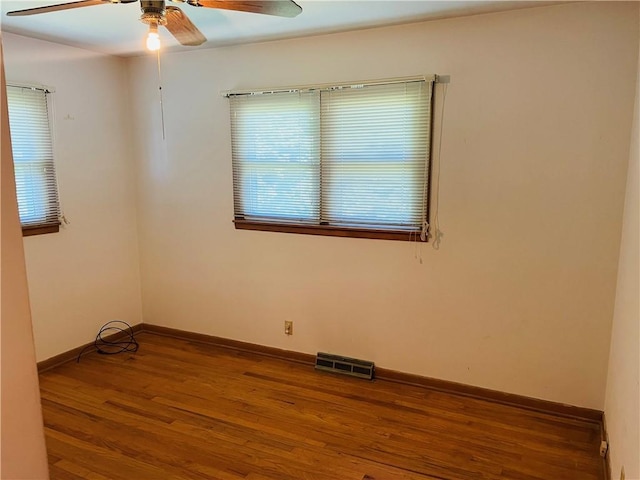 506 1st Ter, Lansing, KS 66043 - unfurnished room with wood finished floors and ceiling fan