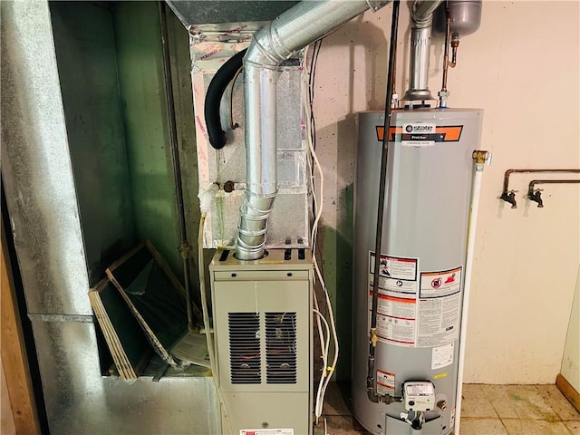 506 1st Ter, Lansing, KS 66043 - utility room featuring gas water heater