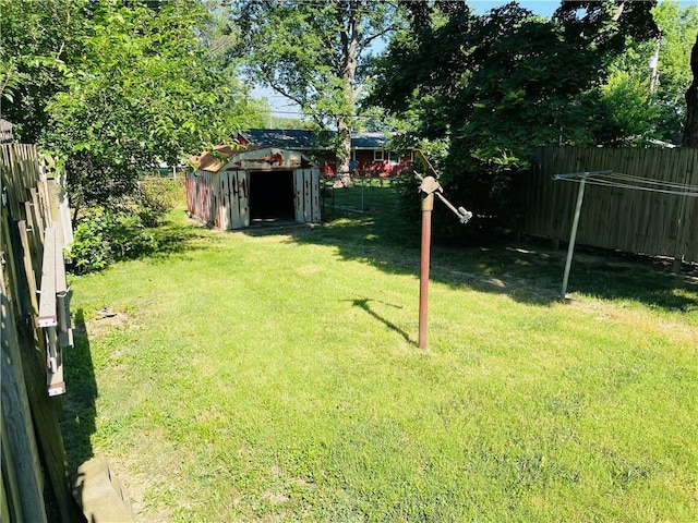 506 1st Ter, Lansing, KS 66043 - fenced backyard with a shed