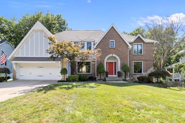 12312 Nieman Rd, Overland Park, KS 66213 - tudor-style house with driveway, brick siding, and a front yard