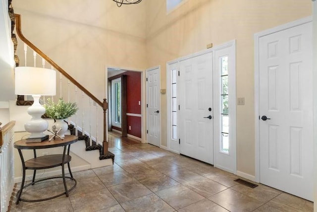 12312 Nieman Rd, Overland Park, KS 66213 - foyer entrance featuring stairs and a high ceiling