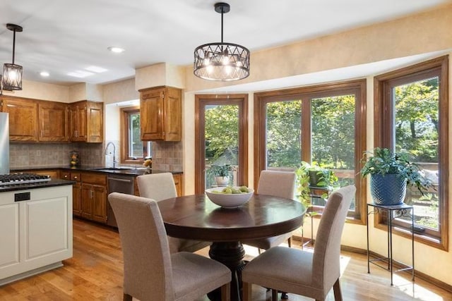 12312 Nieman Rd, Overland Park, KS 66213 - dining space featuring plenty of natural light, light wood finished floors, recessed lighting, and a chandelier