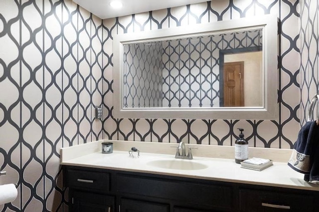 12312 Nieman Rd, Overland Park, KS 66213 - bathroom with wallpapered walls and vanity