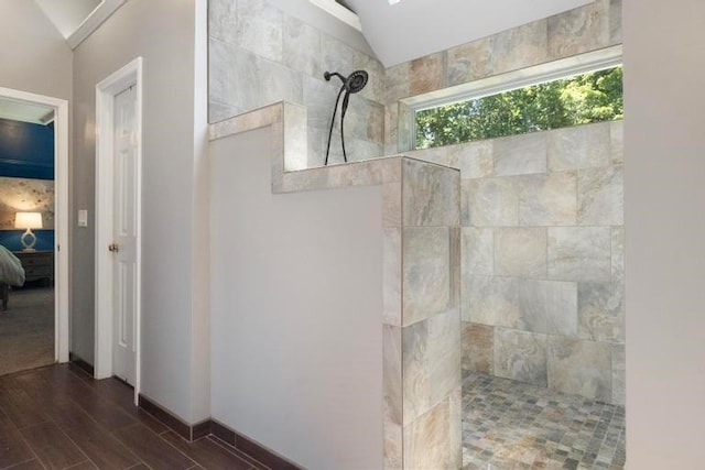 12312 Nieman Rd, Overland Park, KS 66213 - bathroom with lofted ceiling, ensuite bath, walk in shower, and wood finished floors
