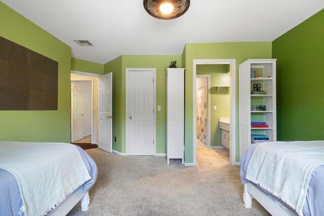 12312 Nieman Rd, Overland Park, KS 66213 - carpeted bedroom featuring baseboards and connected bathroom