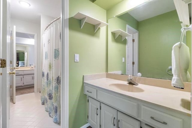 12312 Nieman Rd, Overland Park, KS 66213 - full bath featuring vanity, tile patterned flooring, and curtained shower