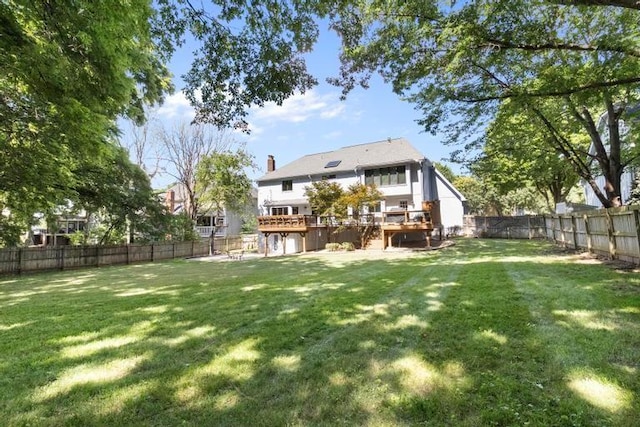 12312 Nieman Rd, Overland Park, KS 66213 - back of property with a wooden deck, a fenced backyard, stairs, and a chimney