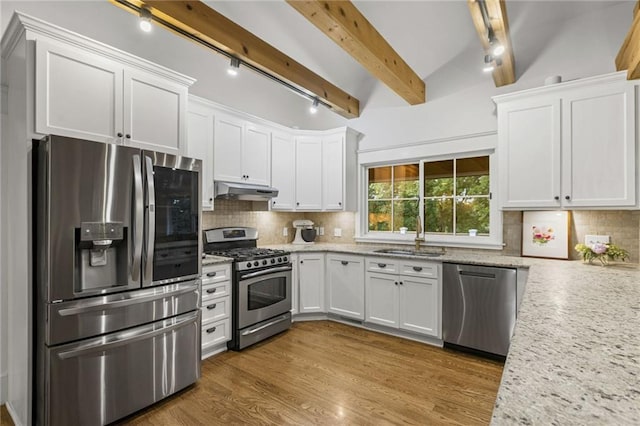 180 Terrace Trl S, Lake Quivira, KS 66217 - kitchen featuring stainless steel appliances, under cabinet range hood, white cabinetry, and light stone counters