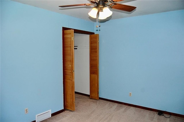 407 Hithergreen Dr, Lansing, KS 66043 - unfurnished bedroom with light colored carpet, a ceiling fan, and a closet