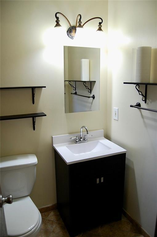407 Hithergreen Dr, Lansing, KS 66043 - bathroom featuring vanity and tile patterned flooring