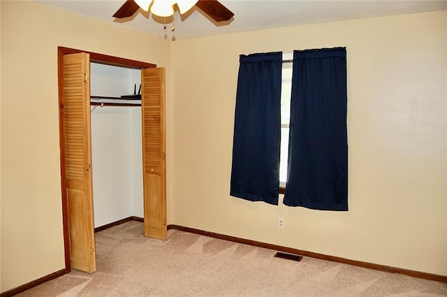 407 Hithergreen Dr, Lansing, KS 66043 - unfurnished bedroom with light carpet, a closet, and ceiling fan