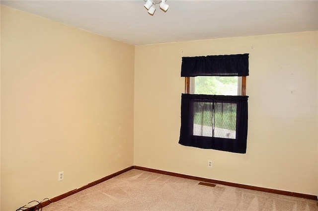 407 Hithergreen Dr, Lansing, KS 66043 - empty room featuring light carpet and baseboards