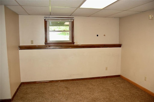 407 Hithergreen Dr, Lansing, KS 66043 - spare room with a paneled ceiling and carpet