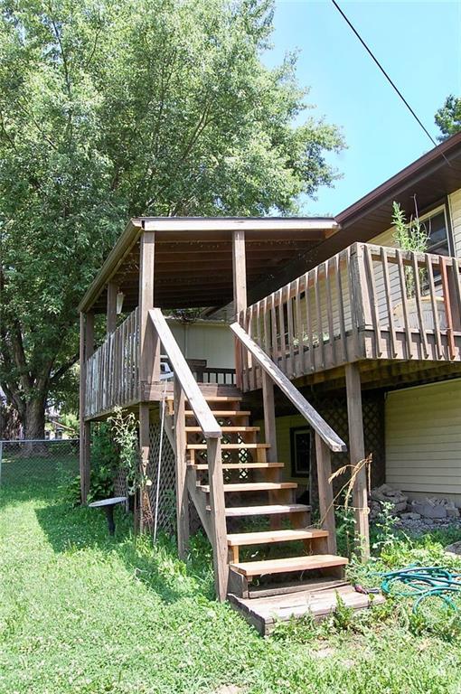 407 Hithergreen Dr, Lansing, KS 66043 - wooden deck with stairway