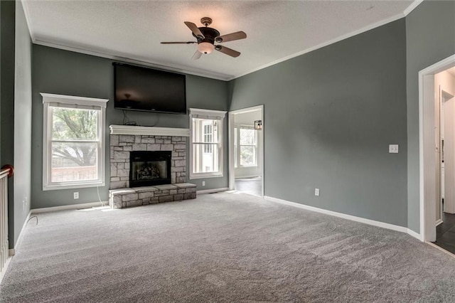 1039 Woodson Cir, Gardner, KS 66030 - unfurnished living room featuring carpet, a ceiling fan, crown molding, a stone fireplace, and a textured ceiling