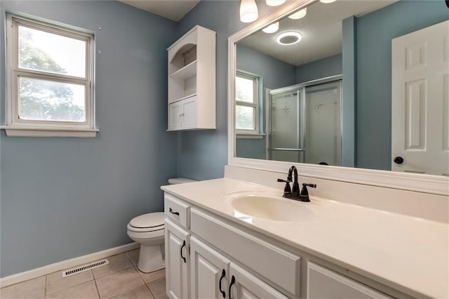1039 Woodson Cir, Gardner, KS 66030 - bathroom with a shower stall, vanity, and tile patterned floors