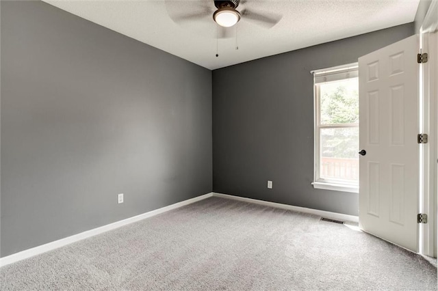 1039 Woodson Cir, Gardner, KS 66030 - carpeted empty room featuring ceiling fan and baseboards