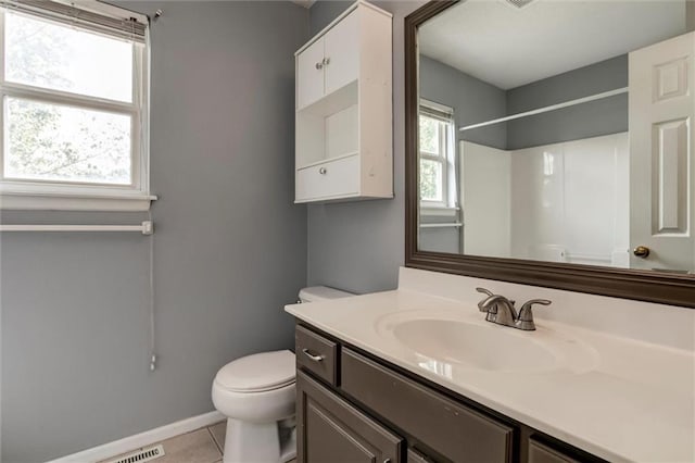 1039 Woodson Cir, Gardner, KS 66030 - bathroom with vanity, tile patterned flooring, and a shower