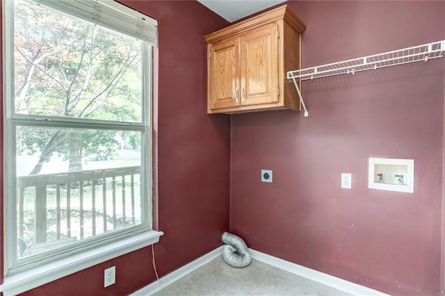 1039 Woodson Cir, Gardner, KS 66030 - washroom featuring hookup for an electric dryer, washer hookup, cabinet space, and healthy amount of natural light