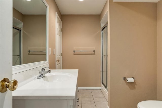 1039 Woodson Cir, Gardner, KS 66030 - full bath featuring a stall shower, tile patterned flooring, and vanity