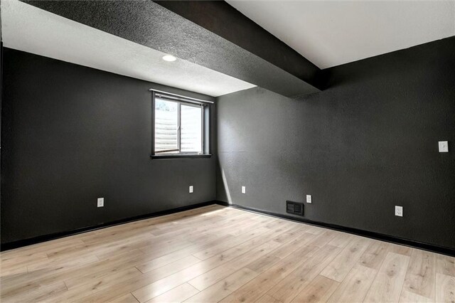 1039 Woodson Cir, Gardner, KS 66030 - unfurnished room featuring wood finished floors and a textured wall