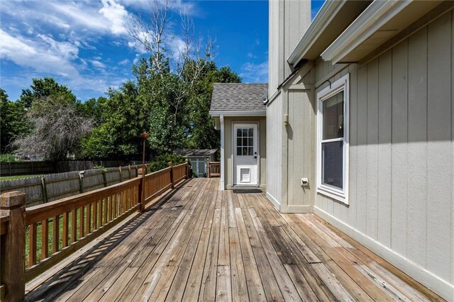 1039 Woodson Cir, Gardner, KS 66030 - wooden terrace featuring a fenced backyard and a shed