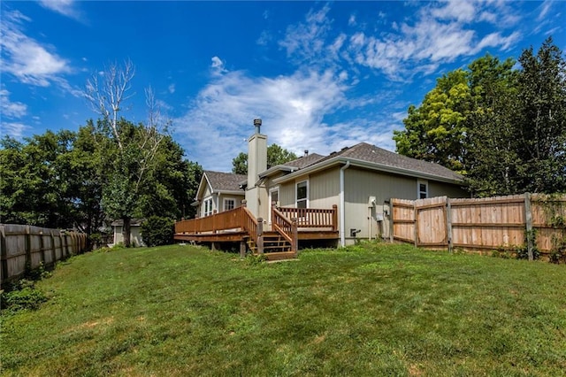 1039 Woodson Cir, Gardner, KS 66030 - rear view of property featuring a wooden deck, a fenced backyard, and a chimney