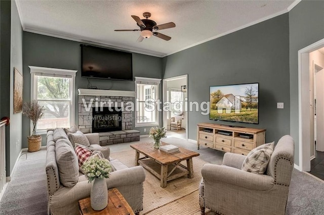 1039 Woodson Cir, Gardner, KS 66030 - living area featuring carpet floors, a fireplace, a ceiling fan, ornamental molding, and a textured ceiling