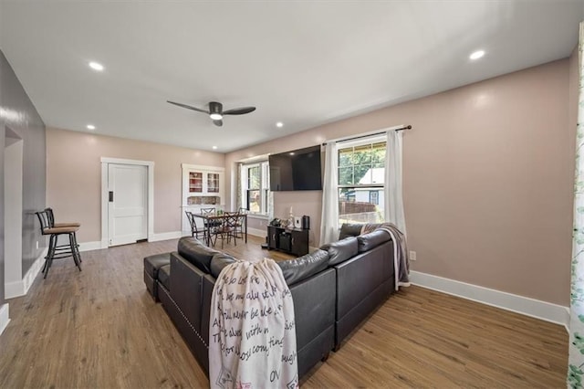 1340 Spruce St, Leavenworth, KS 66048 - living area featuring a ceiling fan, wood finished floors, and recessed lighting
