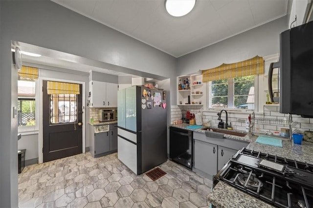 1340 Spruce St, Leavenworth, KS 66048 - kitchen featuring black appliances, decorative backsplash, open shelves, light stone countertops, and ornamental molding