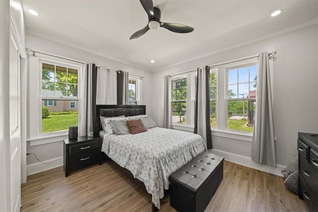 1340 Spruce St, Leavenworth, KS 66048 - bedroom with crown molding, light wood-style floors, a ceiling fan, and recessed lighting