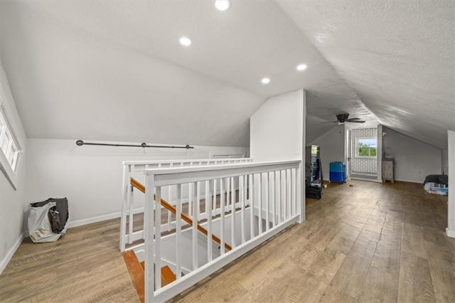 1340 Spruce St, Leavenworth, KS 66048 - additional living space with vaulted ceiling, wood finished floors, a textured ceiling, a ceiling fan, and recessed lighting