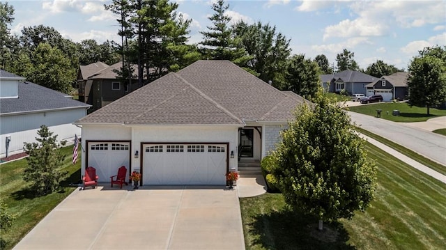801 155th Ter, Basehor, KS 66007 - view of front of home with a garage, concrete driveway, a front yard, a residential view, and a shingled roof