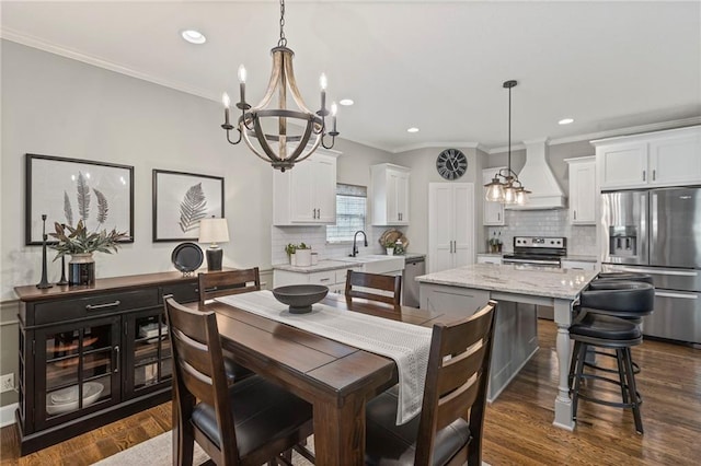 801 155th Ter, Basehor, KS 66007 - dining room with a chandelier, ornamental molding, recessed lighting, and dark wood-style flooring