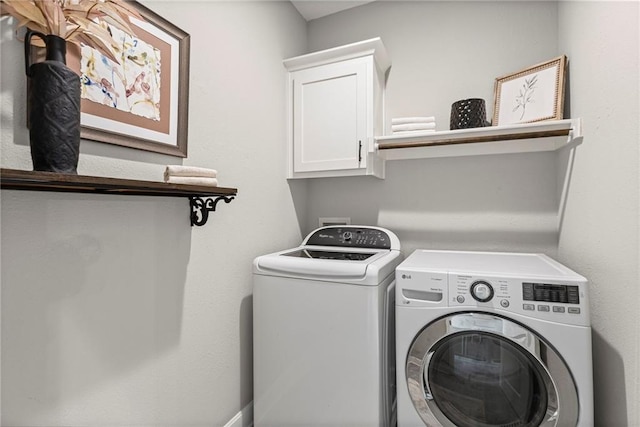 801 155th Ter, Basehor, KS 66007 - laundry area with washing machine and clothes dryer and cabinet space