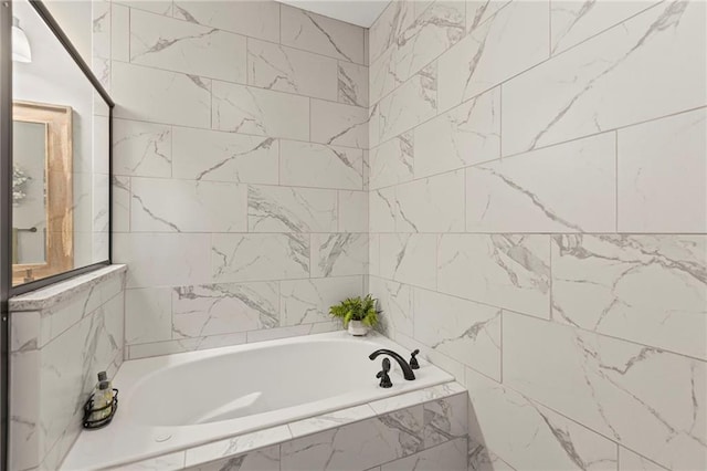 801 155th Ter, Basehor, KS 66007 - bathroom featuring a garden tub and tile walls