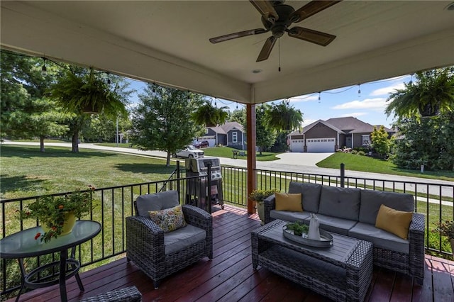 801 155th Ter, Basehor, KS 66007 - wooden terrace featuring an outdoor hangout area, a ceiling fan, concrete driveway, a lawn, and a residential view