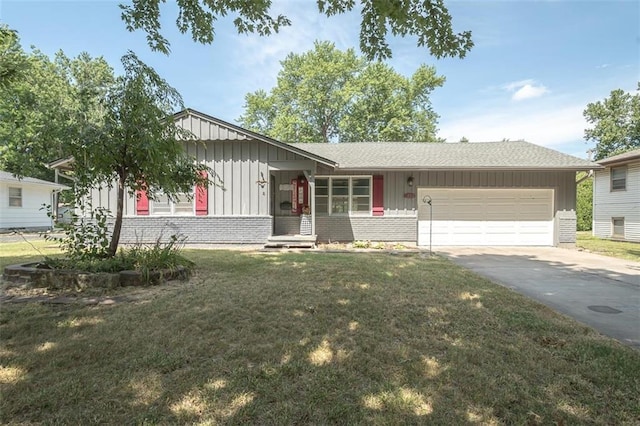 1222 S Maple St, Ottawa, KS 66067 - single story home featuring board and batten siding, concrete driveway, an attached garage, a front yard, and brick siding