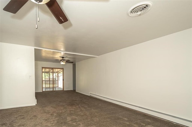1222 S Maple St, Ottawa, KS 66067 - spare room featuring baseboard heating, ceiling fan, and carpet